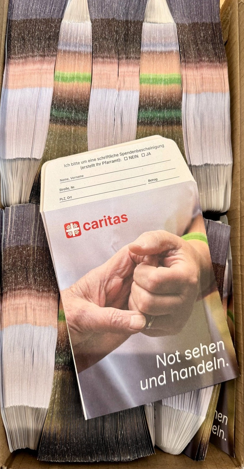 Spendentüten für die Caritas Kollekte